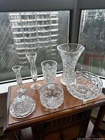 All six crystal pieces on wooden surface