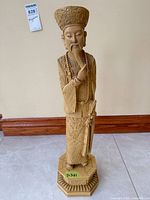 Front view of full figurine with base visible