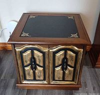 front view showing doors, top panel and trim