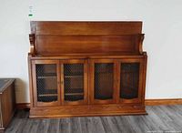 Front view of wooden china cabinet hutch top with four mesh doors