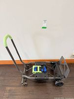 Full view of folded Cosco hand truck showing handle and platform