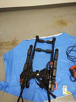 Folded Grabber bike rack with straps and buckles visible