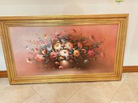 Front view of framed floral oil painting