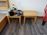 Both Ikea wood side tables side by side