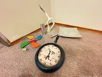 All five items: pan wall clock, fan wall clock, bird figurine, decorative plate, pillar candle