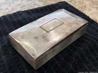 Angled view of sterling silver box showing overall form and sheen