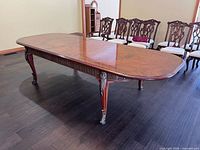 Full view of dining table extended with leaves inserted