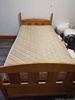 Front view of twin bed frame with mattress