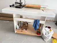 Front view of workbench showing top surface, lower shelf and overall structure