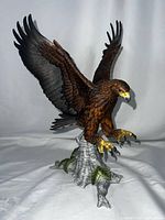 Full view of porcelain eagle figurine with wings spread