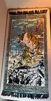 Full view of tiger velveteen tapestry with border and fringe