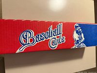 side view of red/blue box labeled Baseball Cards