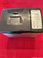 Bread maker exterior showing lid window and control panel