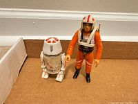 Front view of both figures standing; shows overall appearance and size.