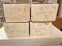 Four cardboard long boxes labeled 1964, 1983, 1988 Topps, unsorted