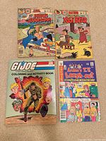 Group shot of all four books laid out front covers visible