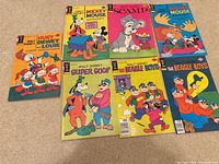 All seven Walt Disney Gold Key comics spread out
