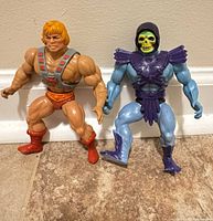 He-Man and Skeletor figures standing side by side