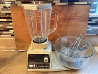 Kitchen center base with blender jar and mixing bowl