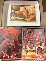 Overview showing Beckett magazine, Patrick Ewing binder and Open Road magazine in box