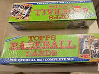 Two sealed Topps 1987 Complete Set boxes top view with branding visible
