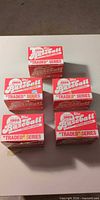 Five 1986 Topps Baseball Traded Series boxes closed, front view