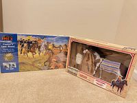 Both boxed sets side by side