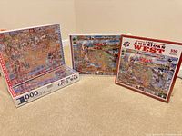 Three sealed White Mountain jigsaw puzzle boxes: The Civil War 1000 pieces, The American West 1000 pieces, The American West 550 pieces