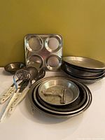 Group shot of all bakeware and utensils against yellow background