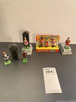 Group shot of all figures, sentry huts, card display and plinth