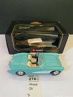 Model car next to original Burago box