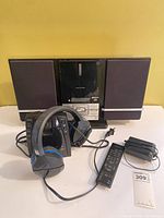 Entire lot: Centrios main unit with two speakers, Turtle Beach headphones on transmitter base, remote, power adapter
