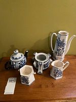 All five porcelain pieces on table
