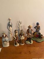 Group view showing all six figurines for scale and variety