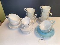 Group shot showing all porcelain cups, saucers and bowls