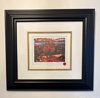 Full view of framed print showing black frame and mat