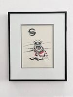 Full view of framed print showing matting and black frame