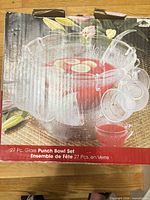 Front of box showing Bali 27-pc glass punch bowl set with image of assembled set
