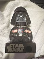 Front view showing figure, STAR WARS logo and control panel