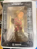 Front of sealed box showing figurine, Men of the Ice branding, Forever logo