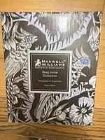 Front of boxed mug showing brand and collection label