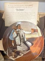 Front view of plate with artwork and certificate