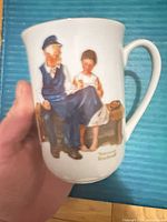Front view showing Rockwell illustration and mug shape