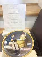 Plate with certificate displayed in open box