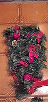 Garland/swag with red bows, beads, ornaments, pinecones