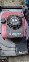 Full top view showing Craftsman mower deck, red engine cover, recoil starter