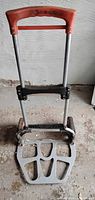 Front view of folding hand truck showing footplate and handle