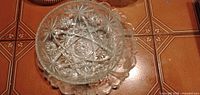 pressed-glass starburst bowl inside scalloped plate
