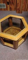 Hexagonal accent table with glass top and wood veneer base