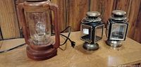 All three lanterns: wood electric lantern with cord, two metal decorative lanterns